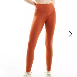 Nike One Training Dri-Fit high rise leggings in Burnt Orange